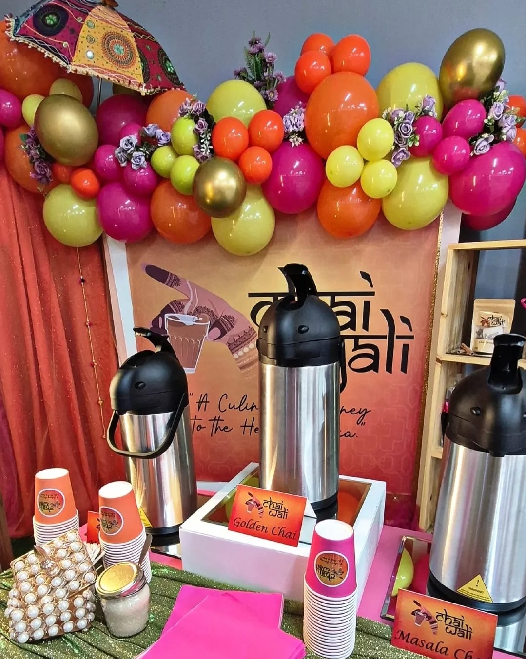 Chai Wali station with Golden Chai and Masala Chai dispensers under a balloon garland
