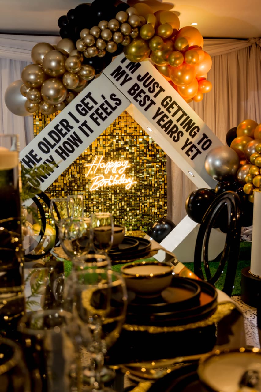 Black and gold birthday celebration styling